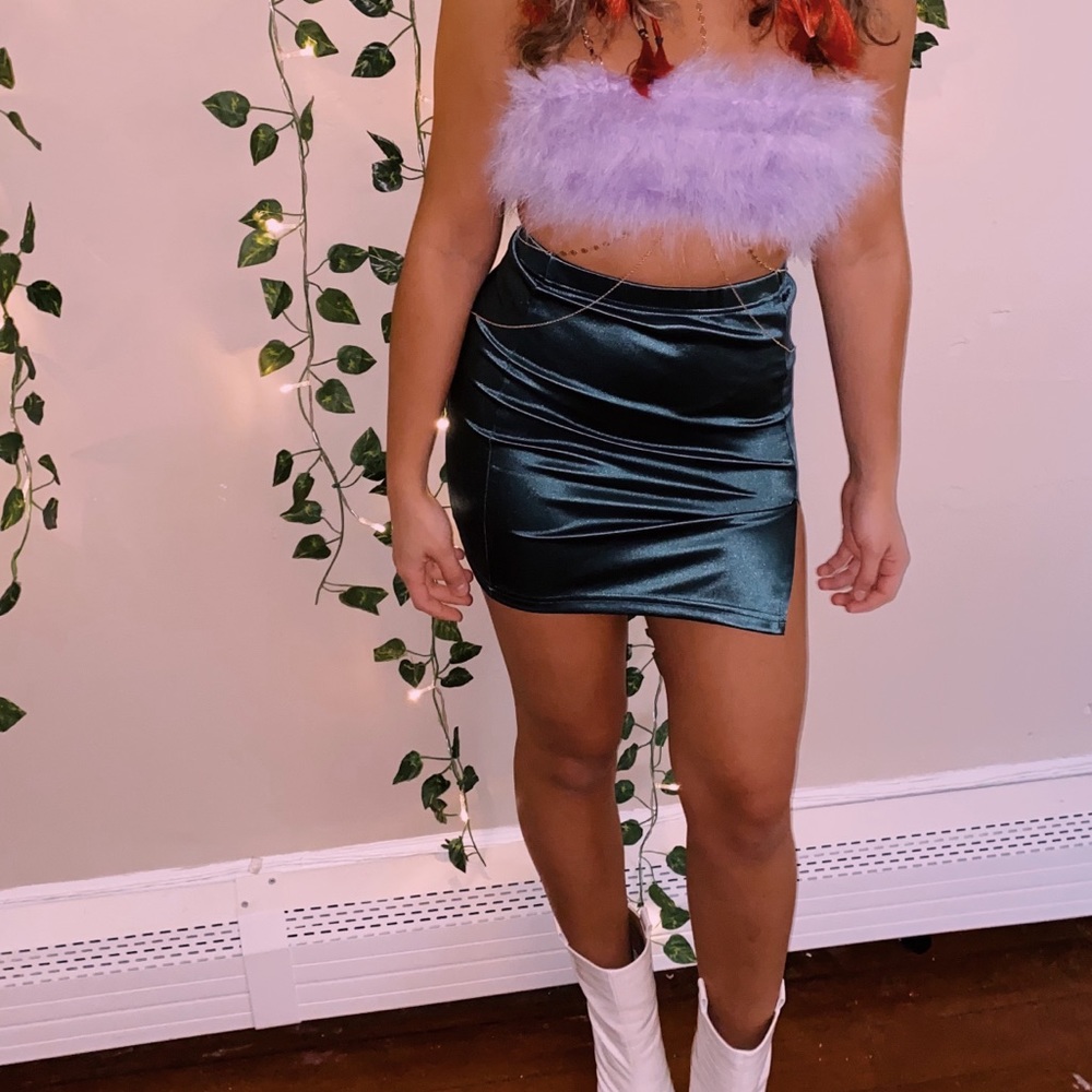 Purple top with green mini skirt